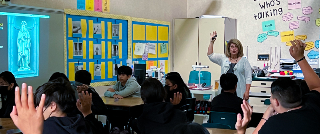 Docent Marcia Klein presents at George M. Shirakawa, Sr. Elementary. Maria Rivero's 7th grade class enjoy an Art in the Dark presentation., reached in May 2023. Photograph by Toby Fernald. May 31, 2023.
