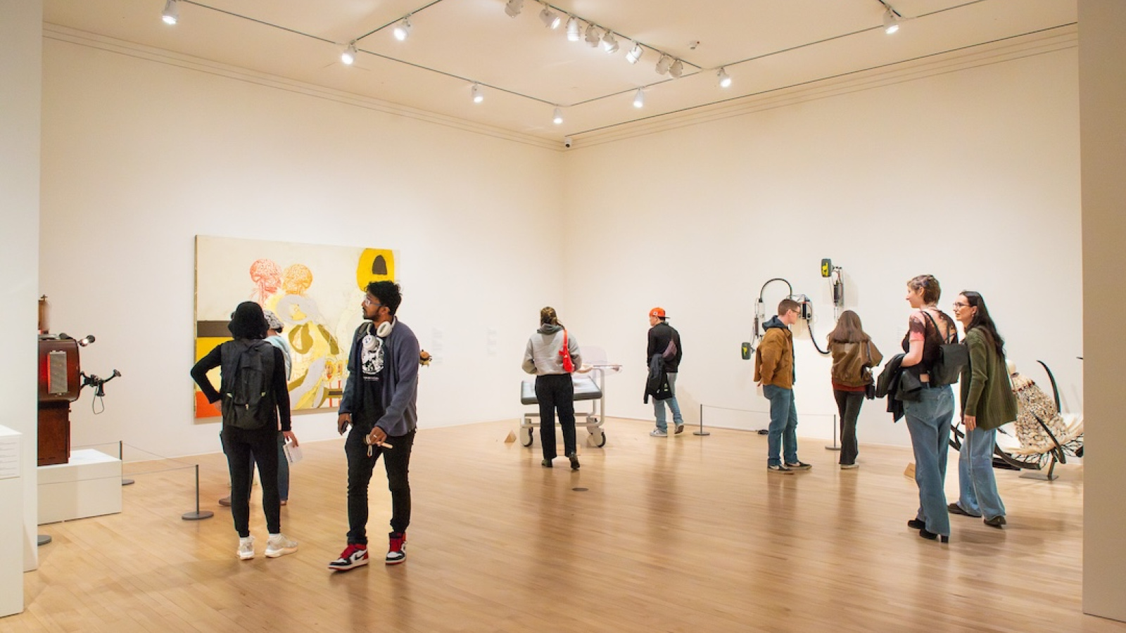visitors in a busy gallery