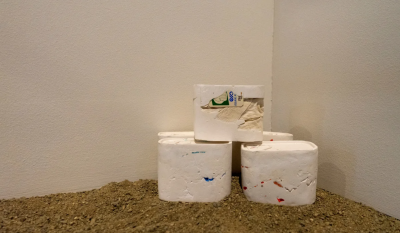 stacks of white objects on dirt