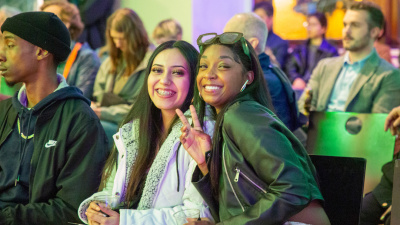 two gal friends cheesing at the camera together