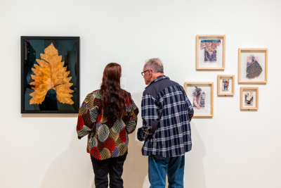 Visitors in a gallery looking at art