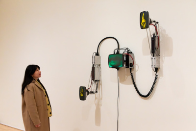 visitor looking intently at an artwork