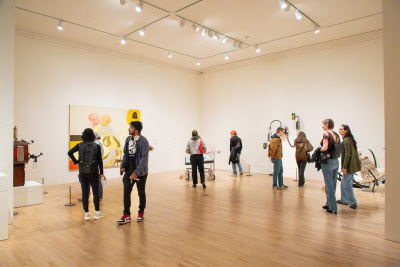 visitors in a busy gallery