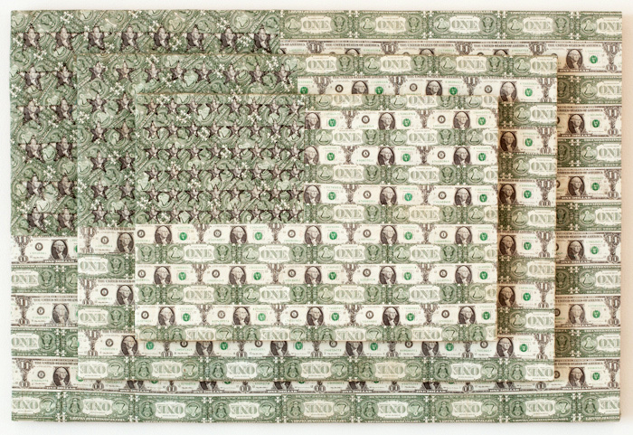 A flag made of United States currency, specifically $20 and $1 bills. They are stacked on top of each other and every other bill is flipped over, to create stripes. The stars are created with bills folded into smaller squares.