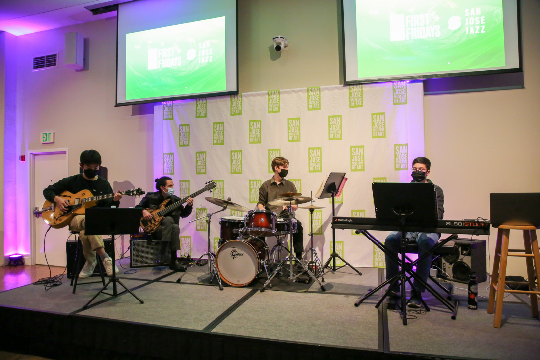Four teens performing as a jazz band.