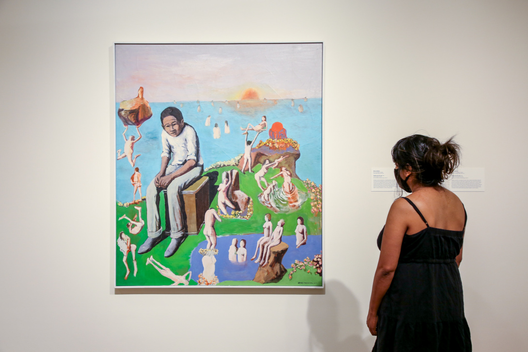 Woman looking at a painting.