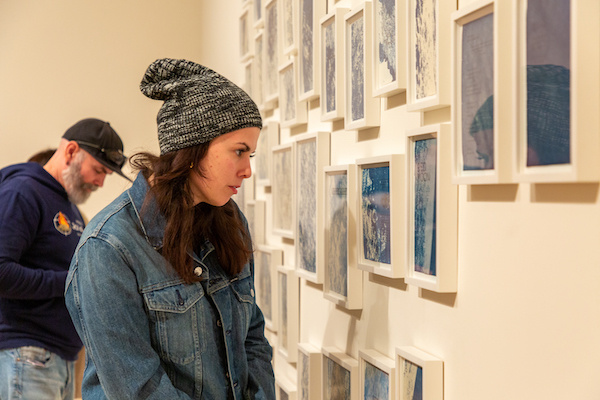 Visitors in a gallery.