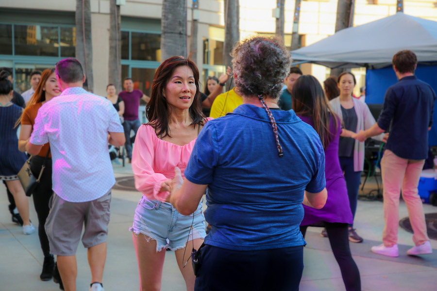 two people dancing in a crowd