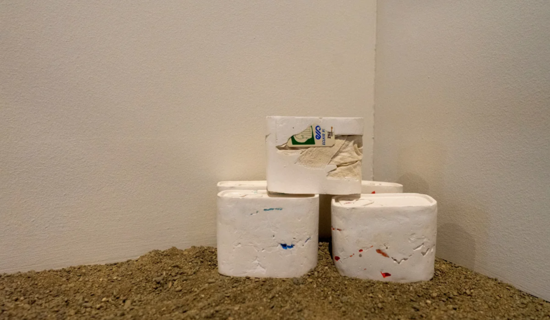 Hương Ngô, And The State of Emergency Is Also Always a State of Emergence, 2017–ongoing stacks of white objects on dirt