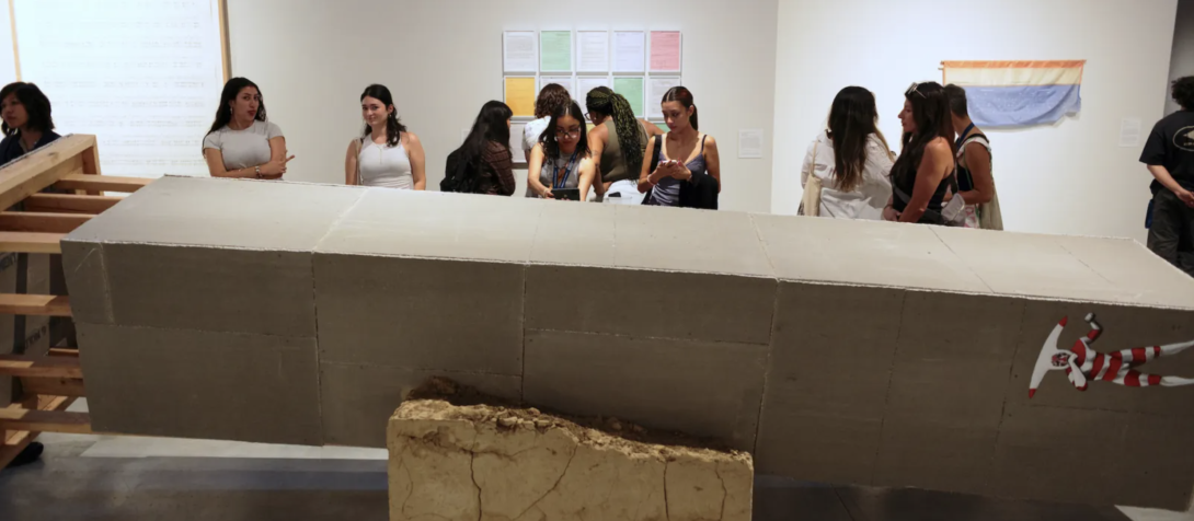 students gazing at a fallen tower