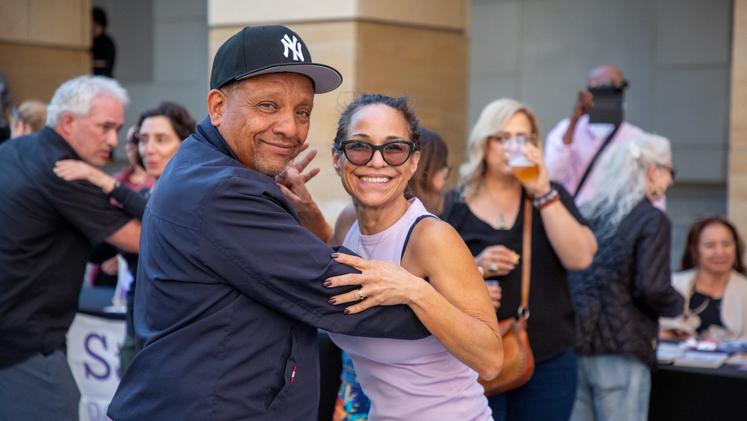 two people dancing and smiling