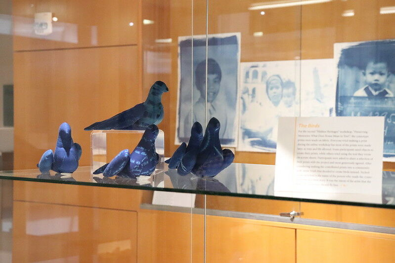 blue sewn birds with cyanotypes in the background