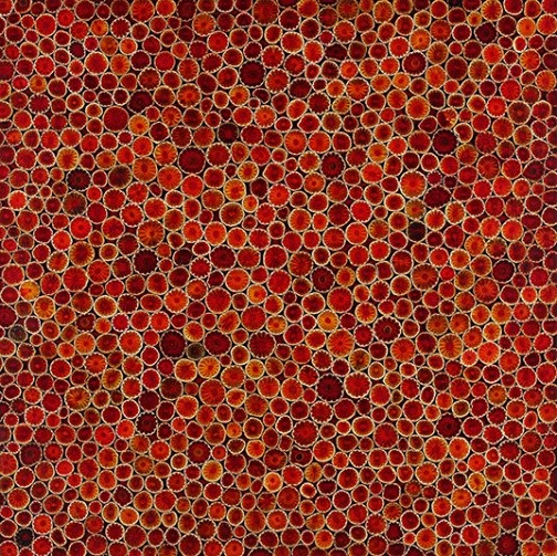 A square painting with a bright red/orange color that looks like heat. A busy pattern with a combination of different colors that is reminiscent of hot summer day. Tiny gold bubbles are arranged next to each other but not aligned.