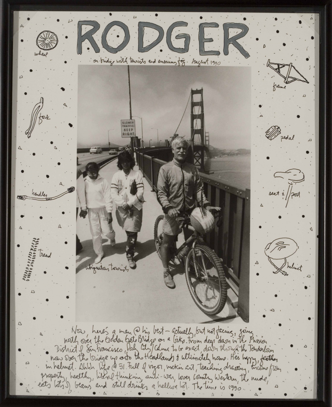 A framed black and white photograph of a man and his family with bicycles on the Golden Gate bridge. The mat surrounding the photo has hand-drawn abstract bike parts, a description at the bottom, and Rodger's name written in big letters at the top.