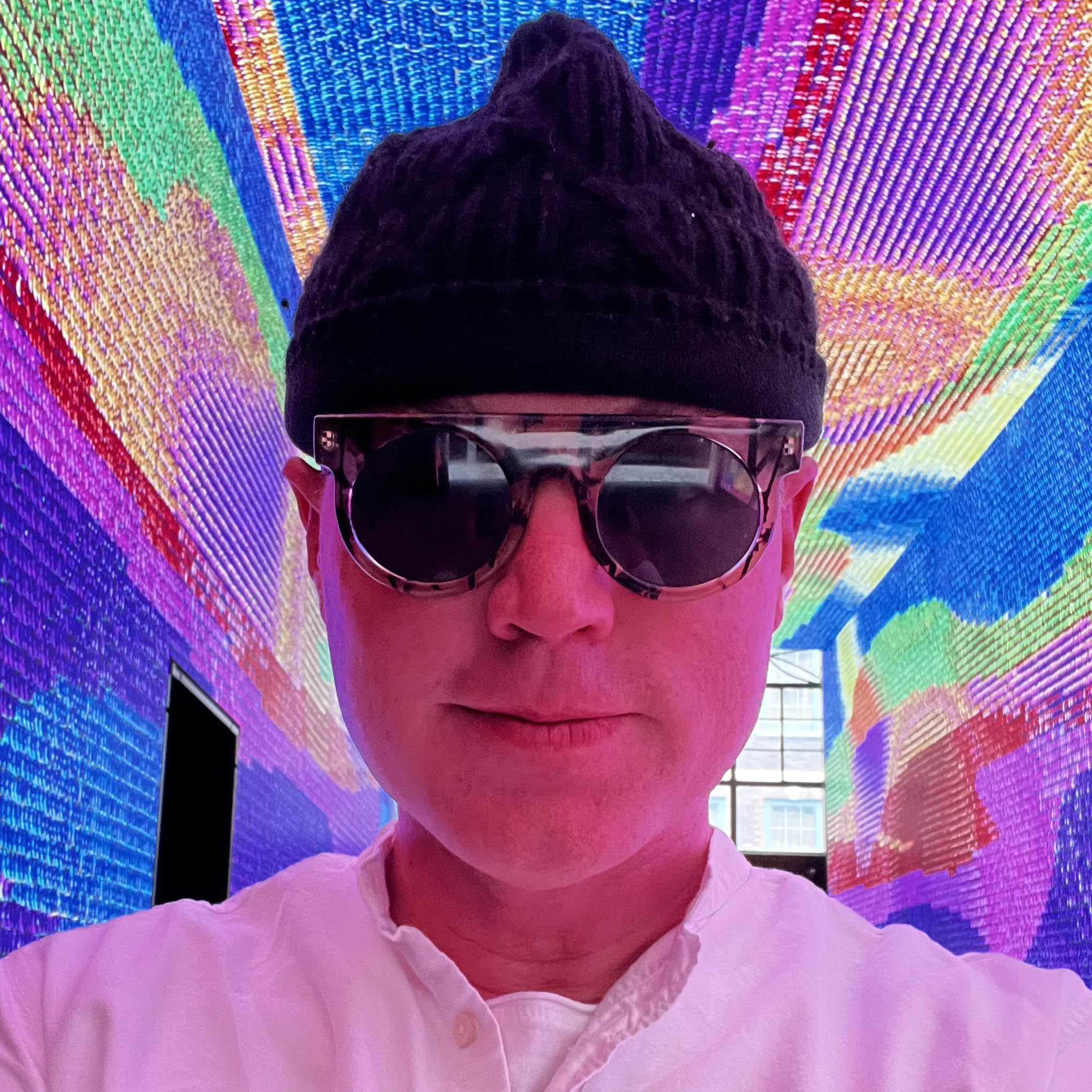 man wearing black beanie and sunglasses