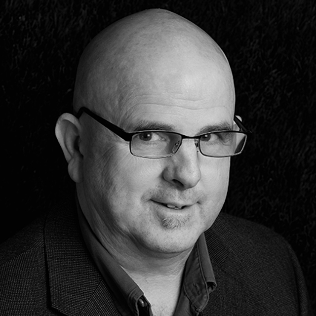 bald man wearing glasses