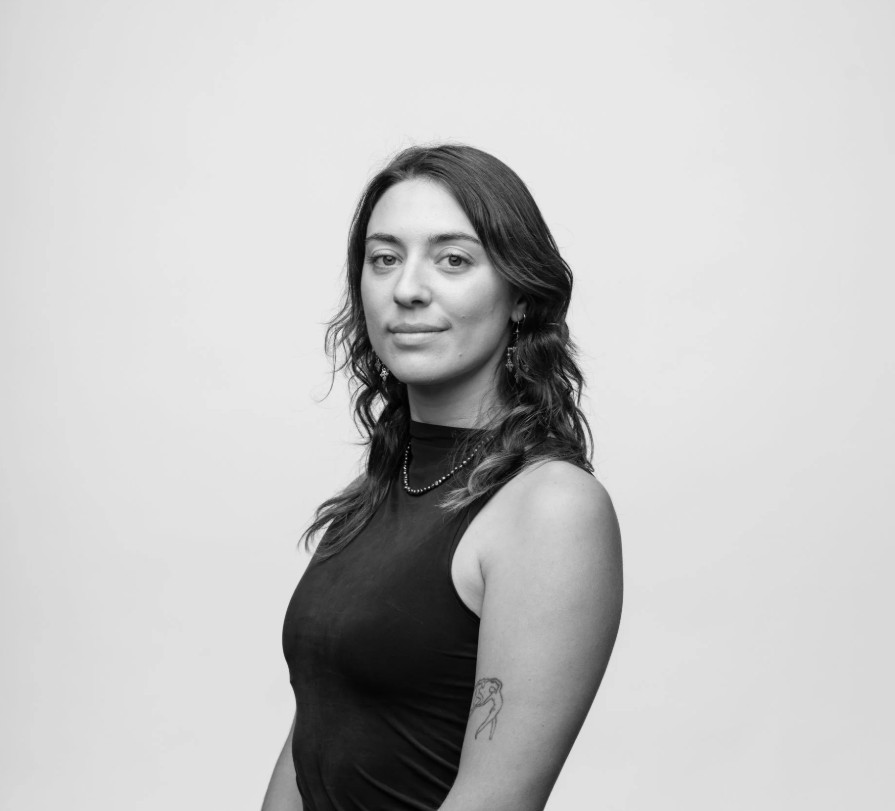 a woman with wavy dark hair